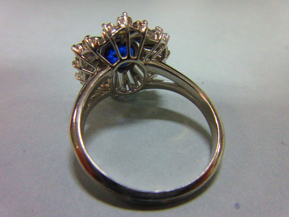 A sapphire and diamond sunburst cluster ring, the round cut light indigo coloured sapphire collet - Image 3 of 5