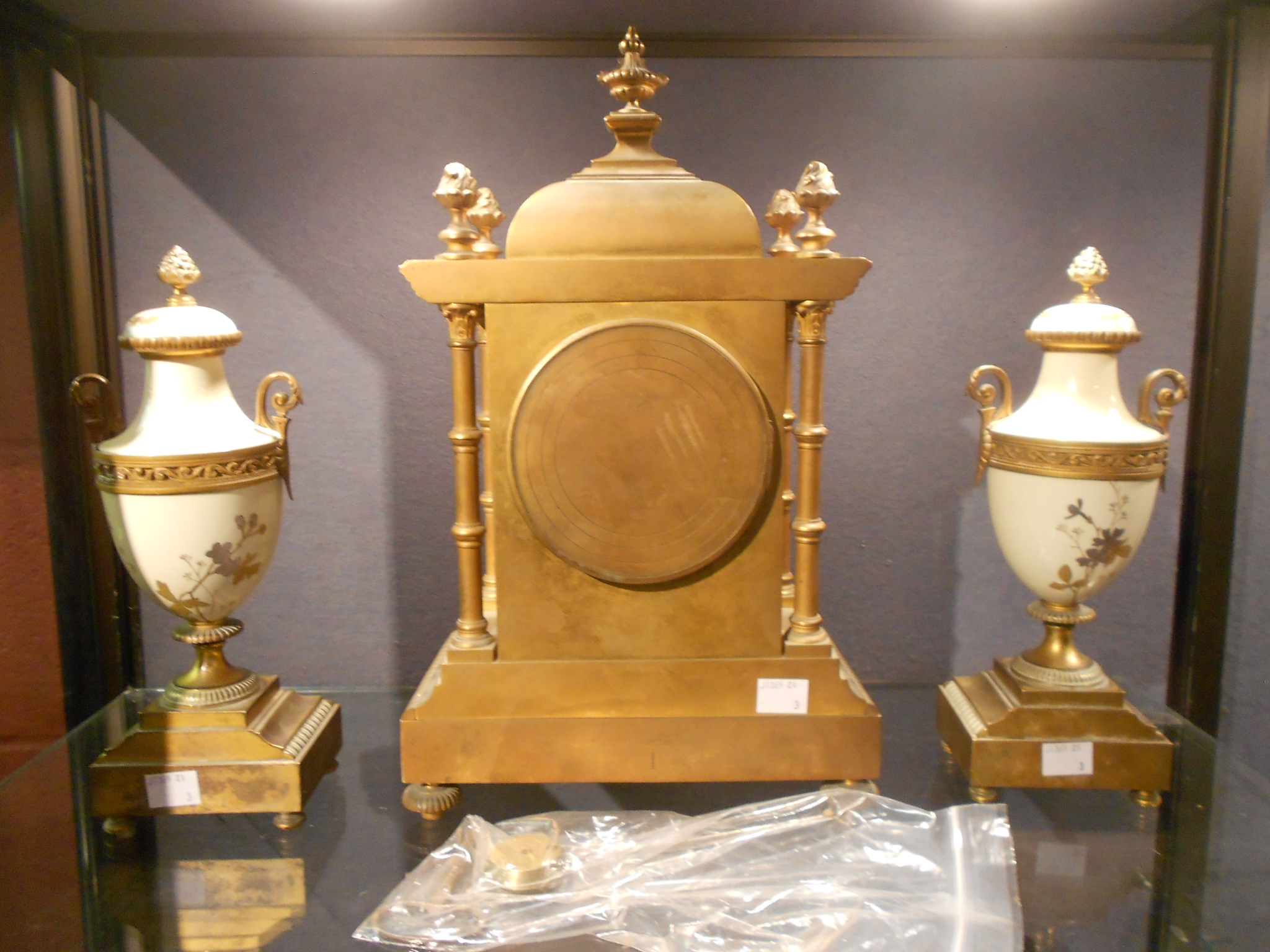 A late Victorian Aesthetic movement clock garniture, the lacquered brass case with domed cresting - Image 2 of 3