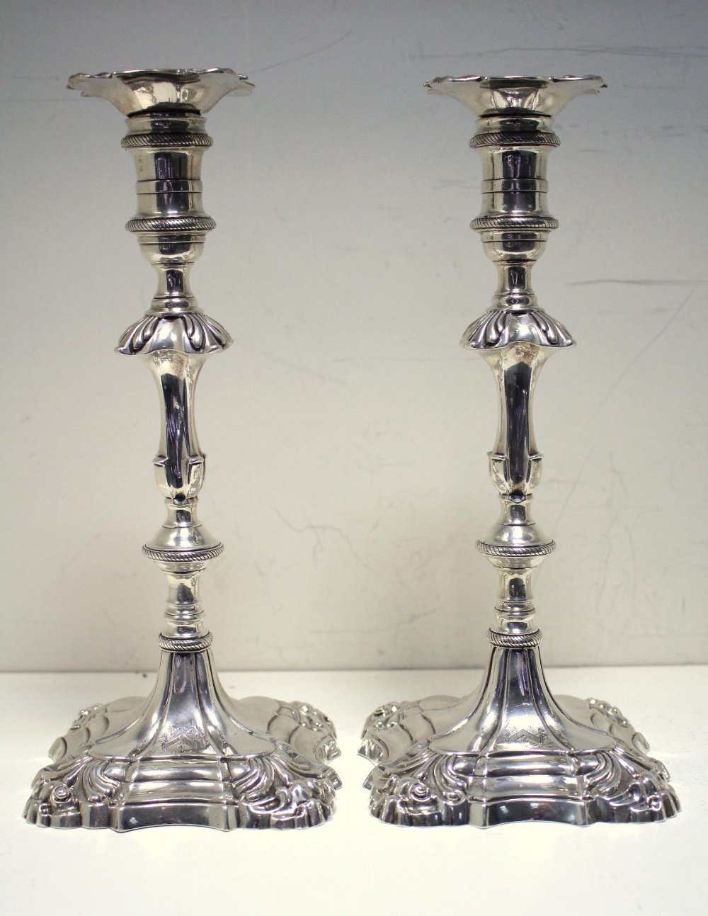 Two pairs of silver candlesticks, by Ebenezer Coker, London 1766/1767, each raised from a square - Image 2 of 11