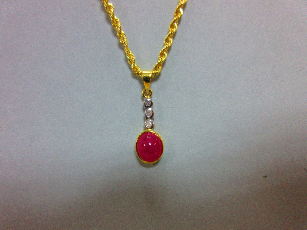 A ruby and diamond pendant with gold chain, the pendant designed as an articulated line of collet - Image 2 of 4