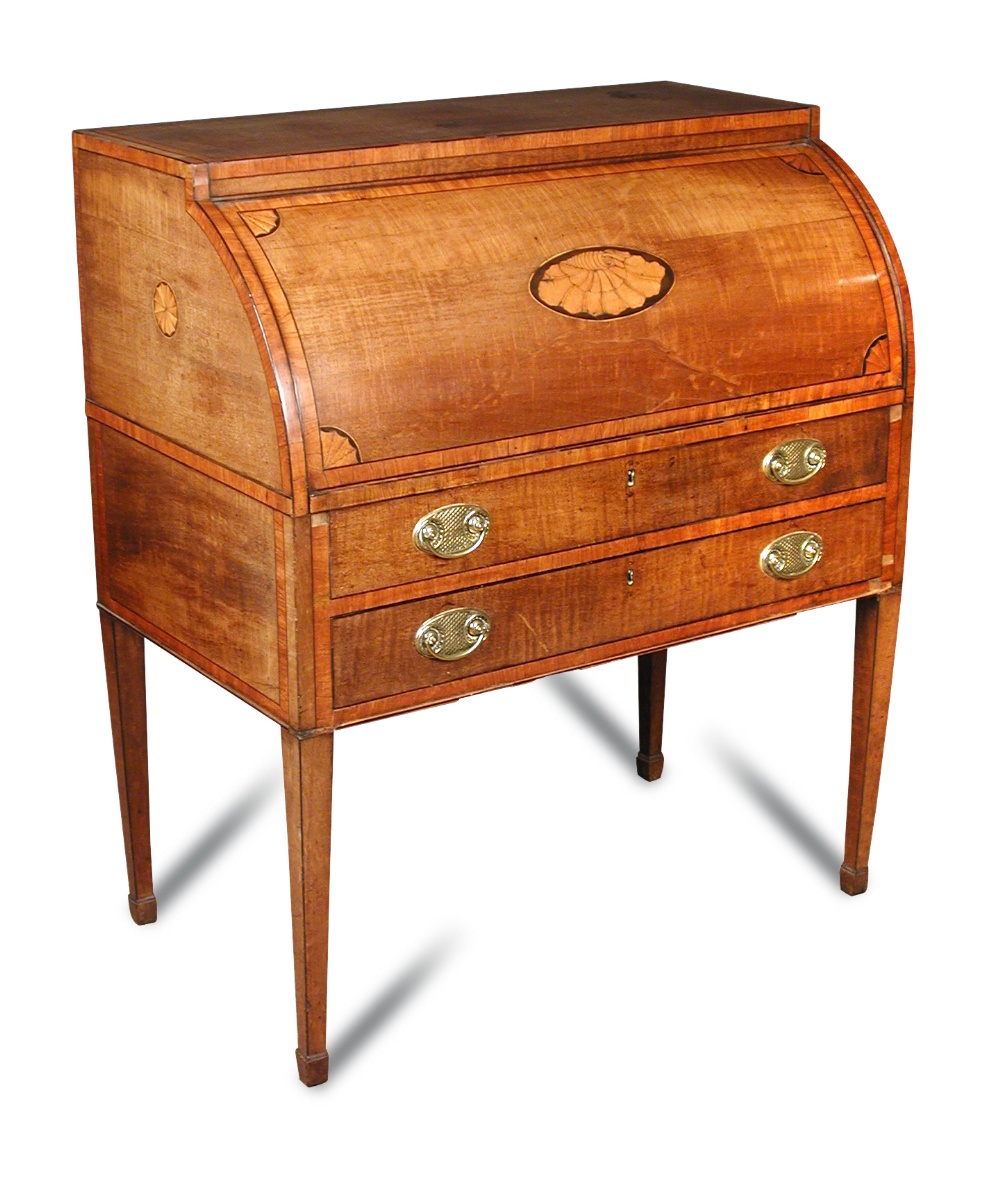 A George III mahogany cylinder bureau, satinwood crossbanded and inlaid with central conch shell and