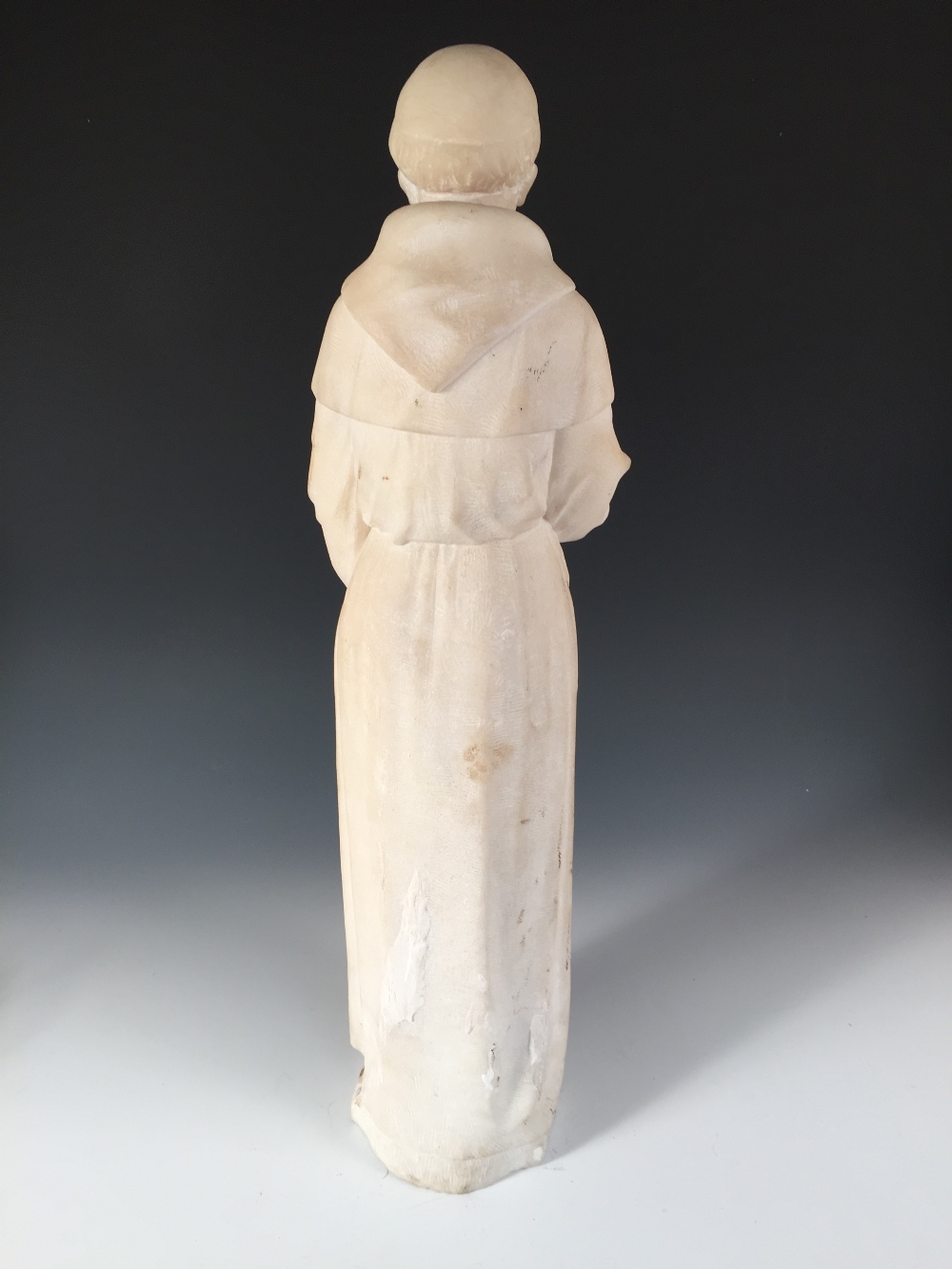 A 19th century white marble figure of a monk, the tonsured figure standing holding a book in his - Image 2 of 3