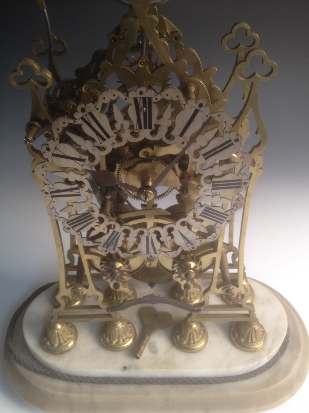 A Victorian brass skeleton clock, the spire top case with bell above pierced silvered chapter ring - Image 2 of 5