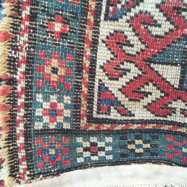 A Caucasian rug, 187 x 113cm (73 x 44in) Worn with low pile, ridging, border losses and binding - Image 5 of 6