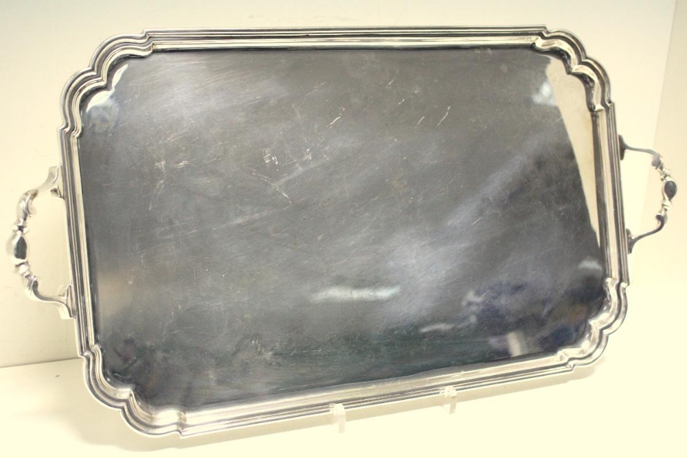 A small silver tray, by Roberts and Belk, Sheffield 1942, of plain rectangular shape with moulded