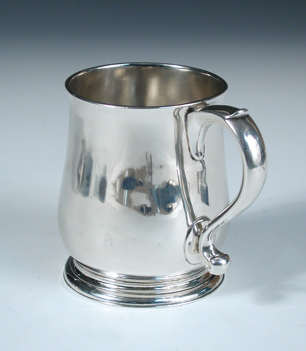 A small George II silver beer mug, probably by William Fordham, London 1728, of plain baluster