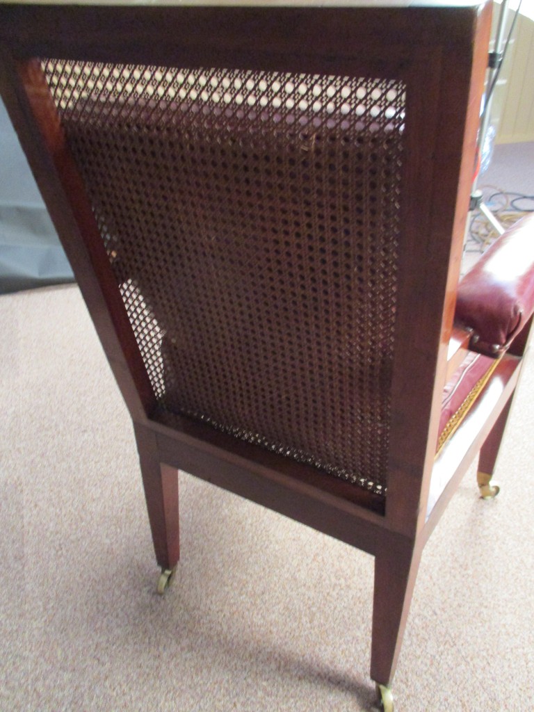 A Regency mahogany library bergere, the arms upholstered in red leather, cane seat with loose - Image 4 of 4