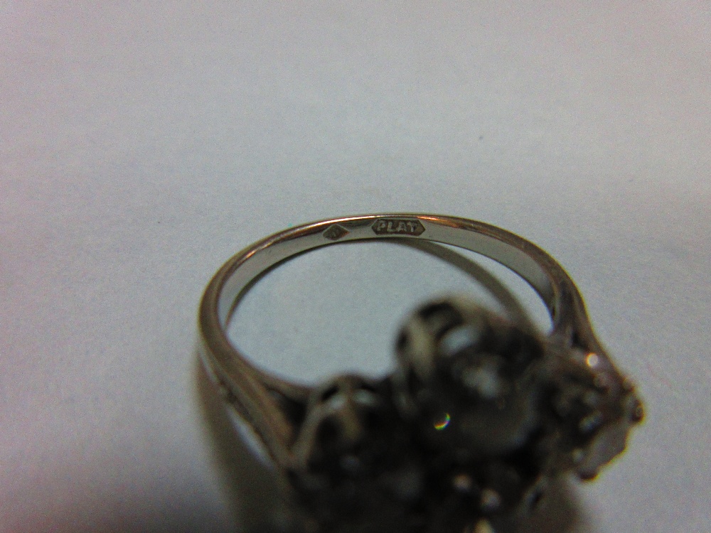 An unusual four stone diamond ring, the old round brilliant cut diamonds claw set in a horizontal - Image 6 of 7