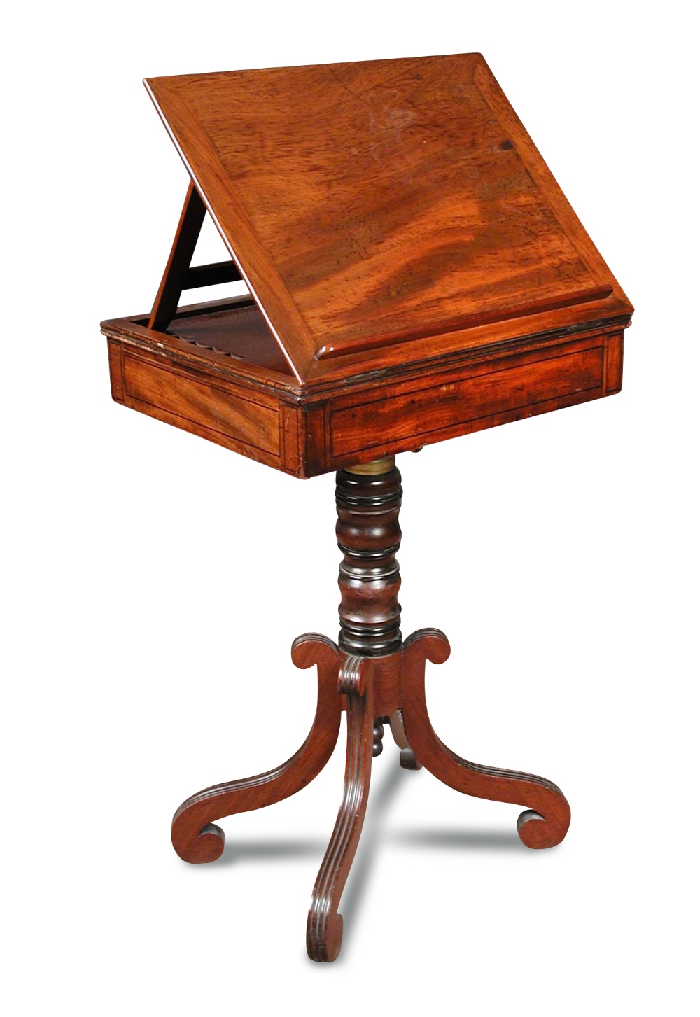 A Regency mahogany reading table, with adjustable slope, fitted end drawer for ink wells and pens,