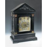 Thomas Russell & Son, London, an imposing Victorian ebonised case chiming clock, the architecturally