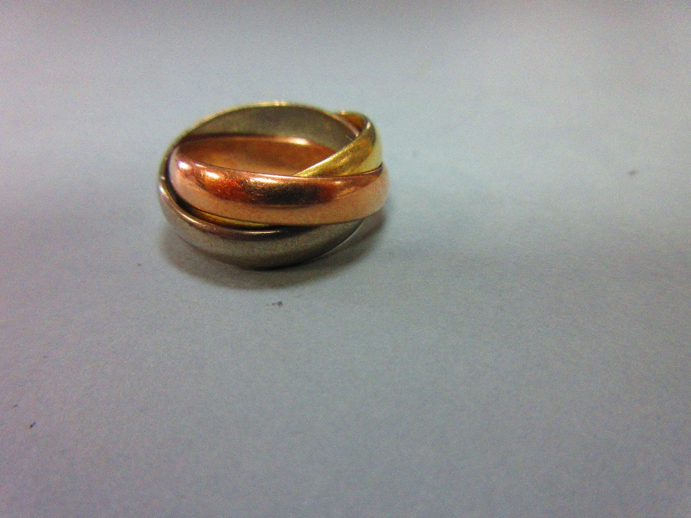 An 18ct three colour gold 'Russian wedding' ring, the three interlocking plain D-section bands, - Image 4 of 5