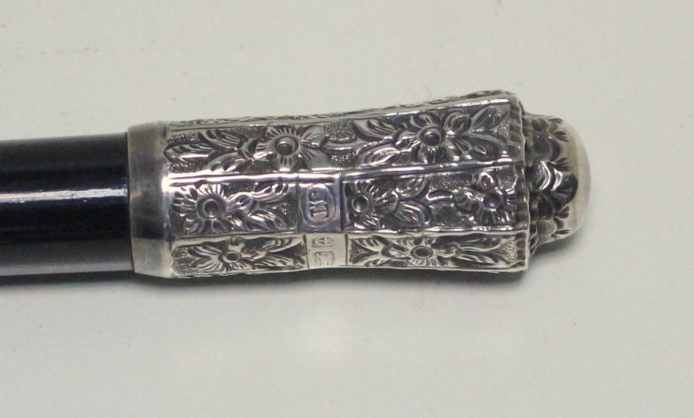 A silver mounted ebony conductor's baton, the cap by Joseph Taylor, Birmingham 1903, the central - Image 4 of 4