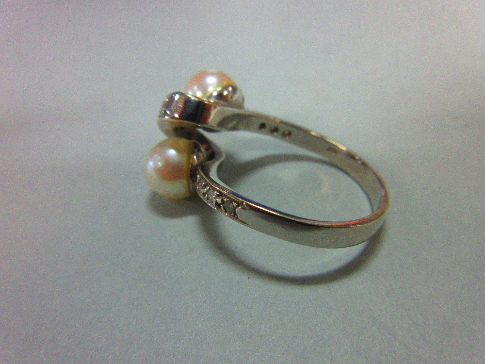 A Continental white gold, pearl and diamond crossover ring, the plain shank set to the front with - Image 3 of 5