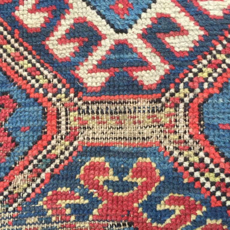 A Caucasian rug, 187 x 113cm (73 x 44in) Worn with low pile, ridging, border losses and binding - Image 3 of 6