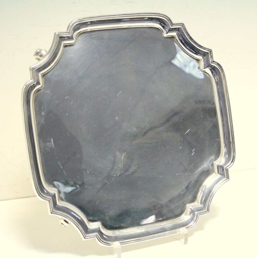 A silver salver, by the Adie Brothers, Birmingham 1939, square with shaped canted corners and - Image 2 of 4