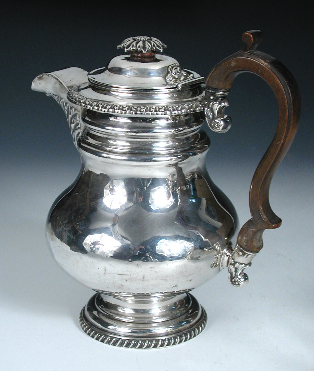 A George IV silver coffee pot/hotwater jug, by I & G Fearn, Sheffield 1823, of broad baluster form