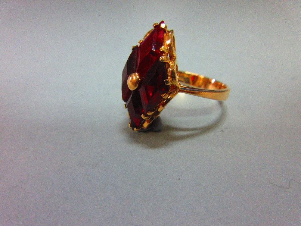 A modern red hardstone ring, the four diaper step cut deep crimson red stones, believed to be - Image 2 of 4