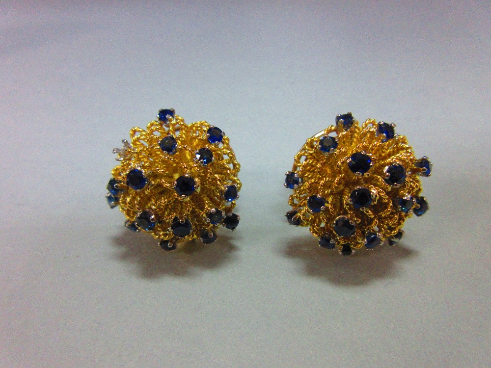 A pair of mid 20th century sapphire earrings cased by Cartier, each earstud of boss profile and