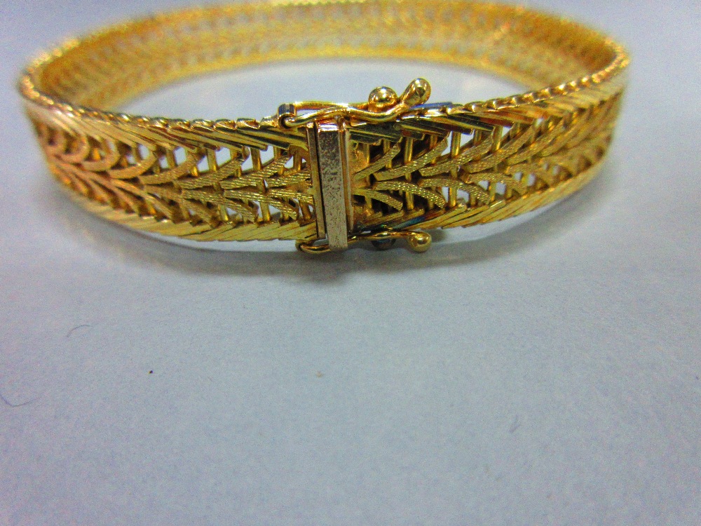 An Austrian 14ct gold bracelet, the delicate pierced polished and textured ribbon band, width 1cm, - Image 2 of 5