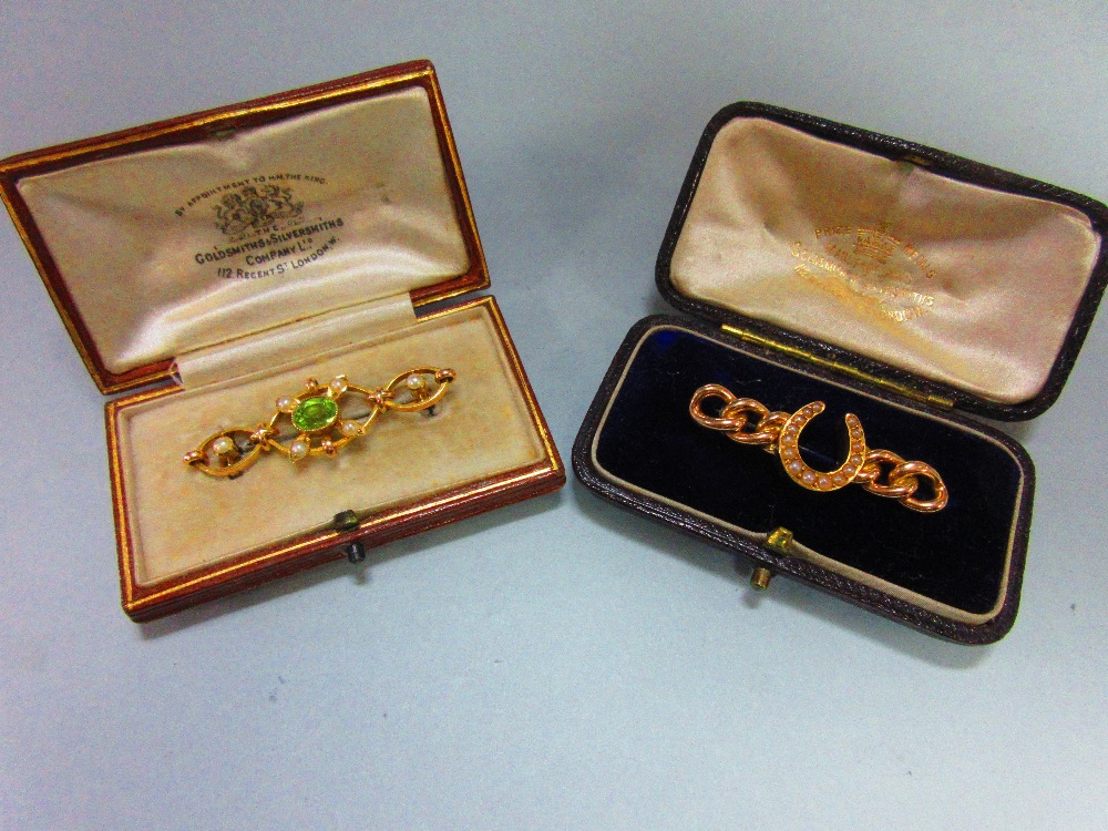 Two period seed pearl brooches both in gold tooled leather fitted cases by the Goldsmiths' &