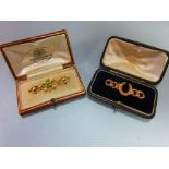 Two period seed pearl brooches both in gold tooled leather fitted cases by the Goldsmiths' &