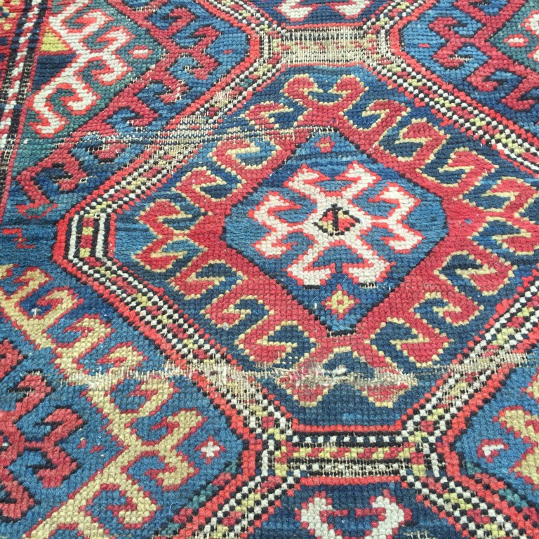 A Caucasian rug, 187 x 113cm (73 x 44in) Worn with low pile, ridging, border losses and binding - Image 4 of 6