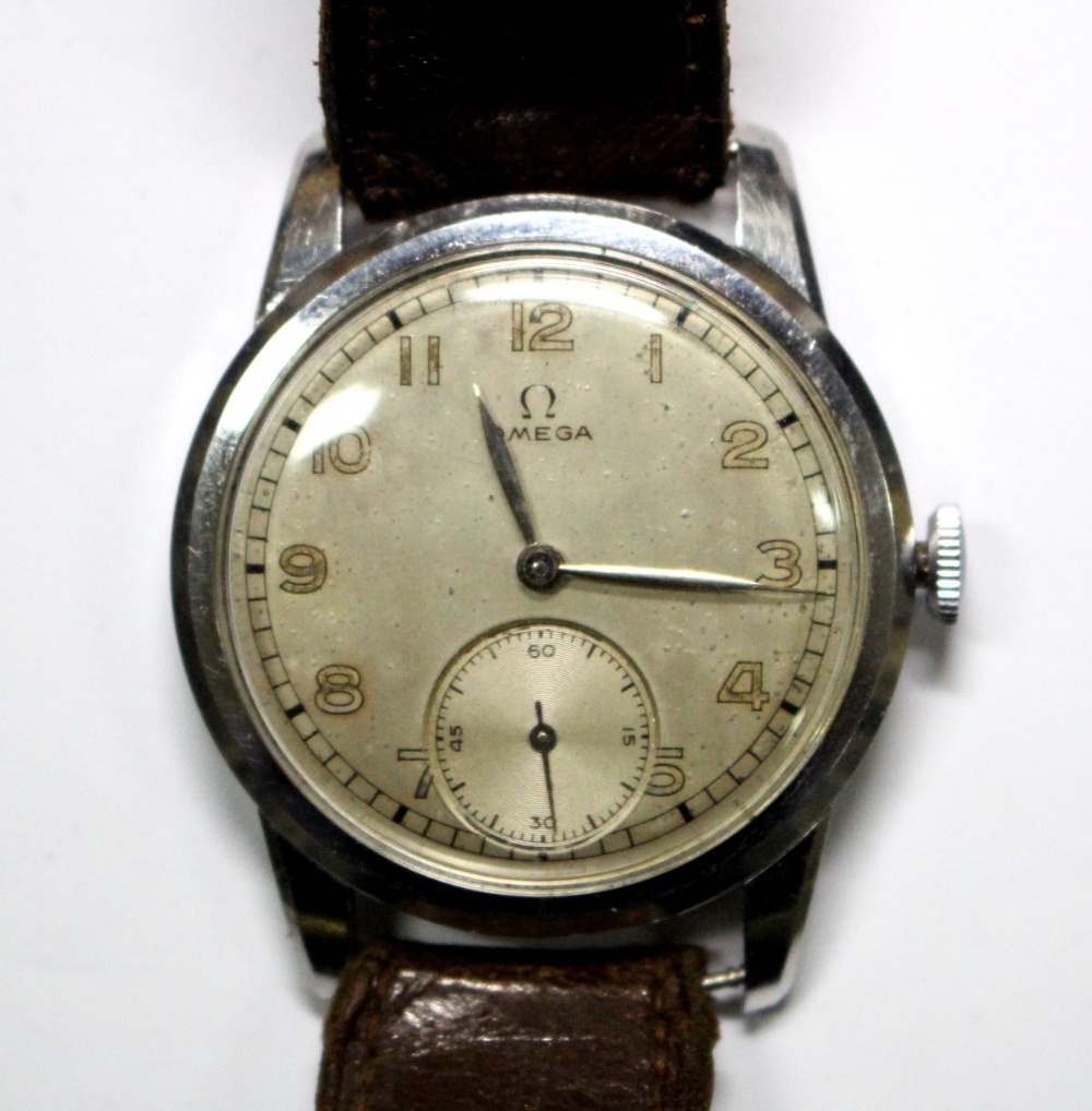 By Omega - a gentleman's steel cased wristwatch, circa 1940's, silvered dial with painted Arabic