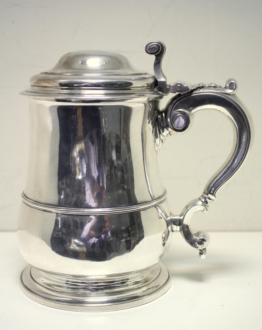 A George II silver tankard, by Lewis Hamon, London 1737, of plain baluster form with moulded edge - Image 2 of 7