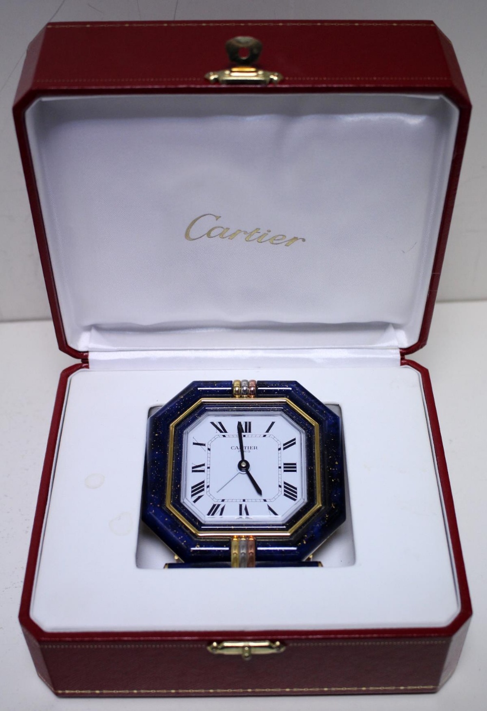 By Cartier - a brass cased travel alarm clock, with blue enamel and three tone gold plated octagonal - Image 3 of 4