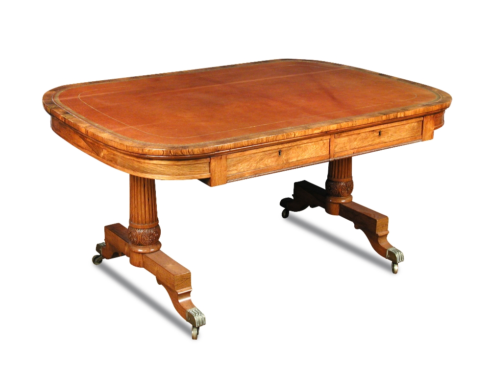 A George IV rosewood library table, leather lined top, fitted two blind frieze drawers, on reeded