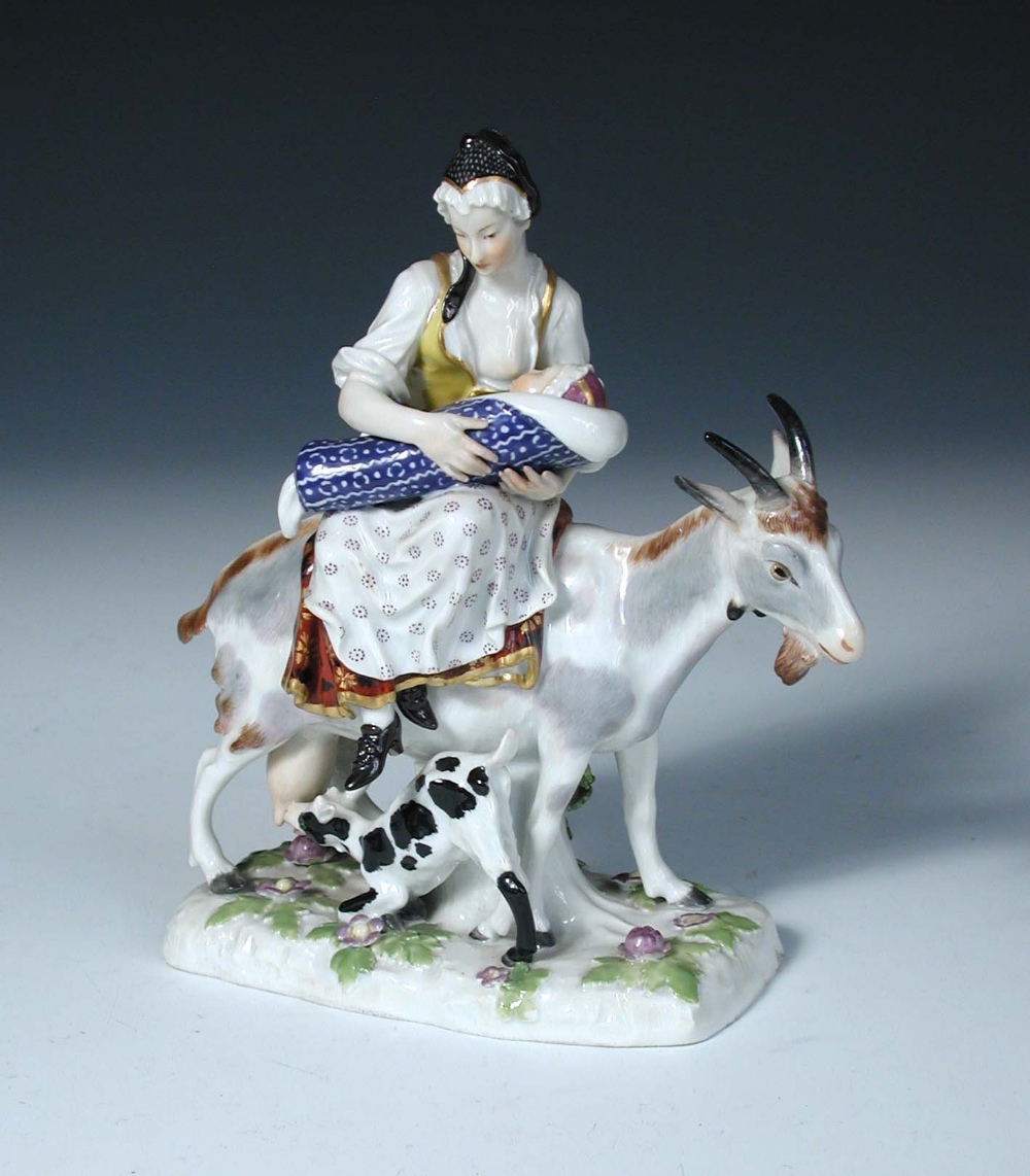 After Eberlein, a Meissen figure of the Tailor's wife, she suckles her child while riding a goat