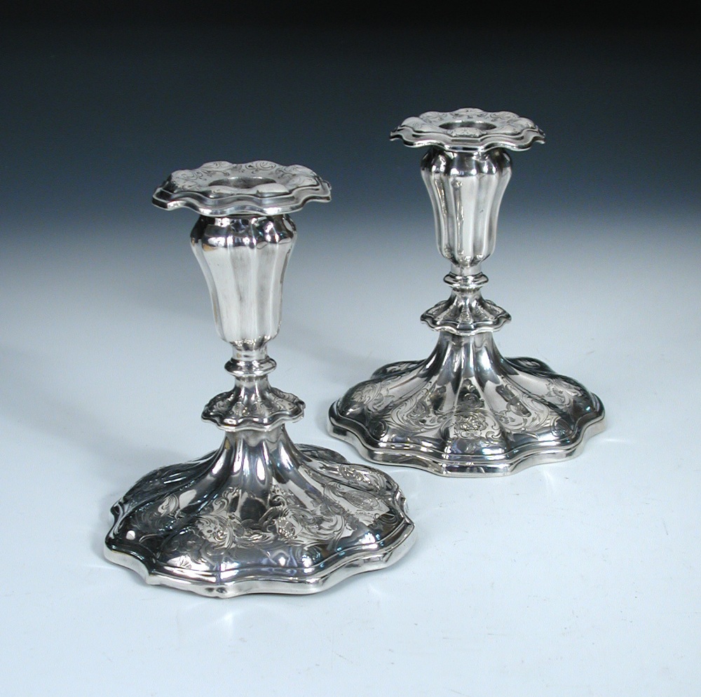 A pair of Victorian silver dwarf candlesticks, by Henry Wilkinson & Co, Sheffield 1849, the lobed