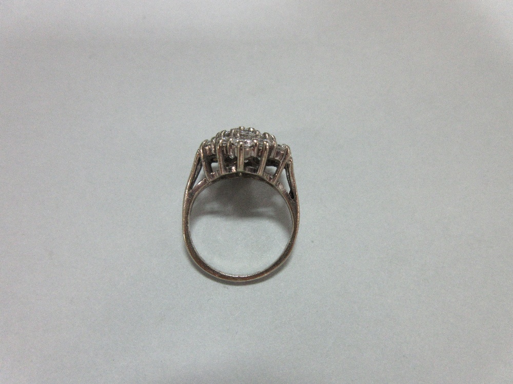 A diamond cluster ring set in 18ct gold, closely set with nineteen round brilliant cut diamonds in a - Image 3 of 6