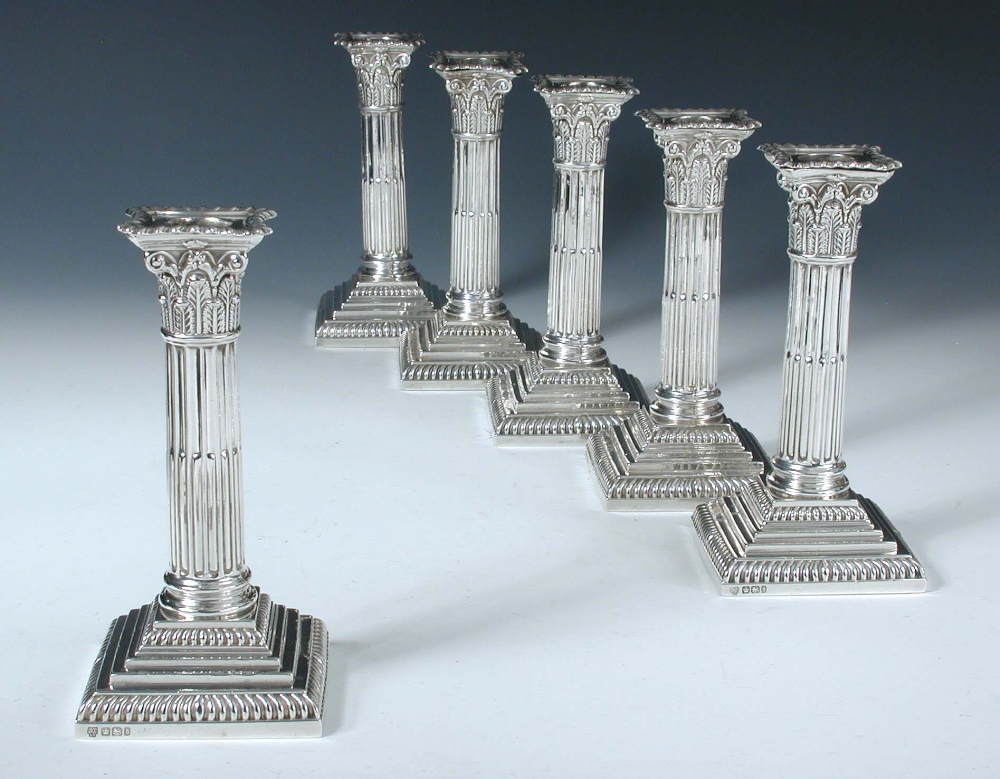 A set of six late Victorian dwarf candlesticks, by Hawksworth, Eyre & Co, Sheffield 1899/1900,