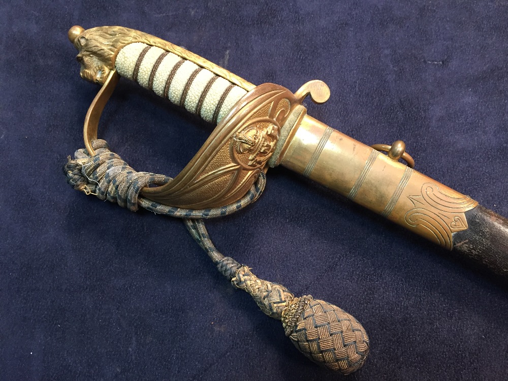A George V Naval sword by Miller & Sons, London & Southampton, with RNR etched decoration, typical