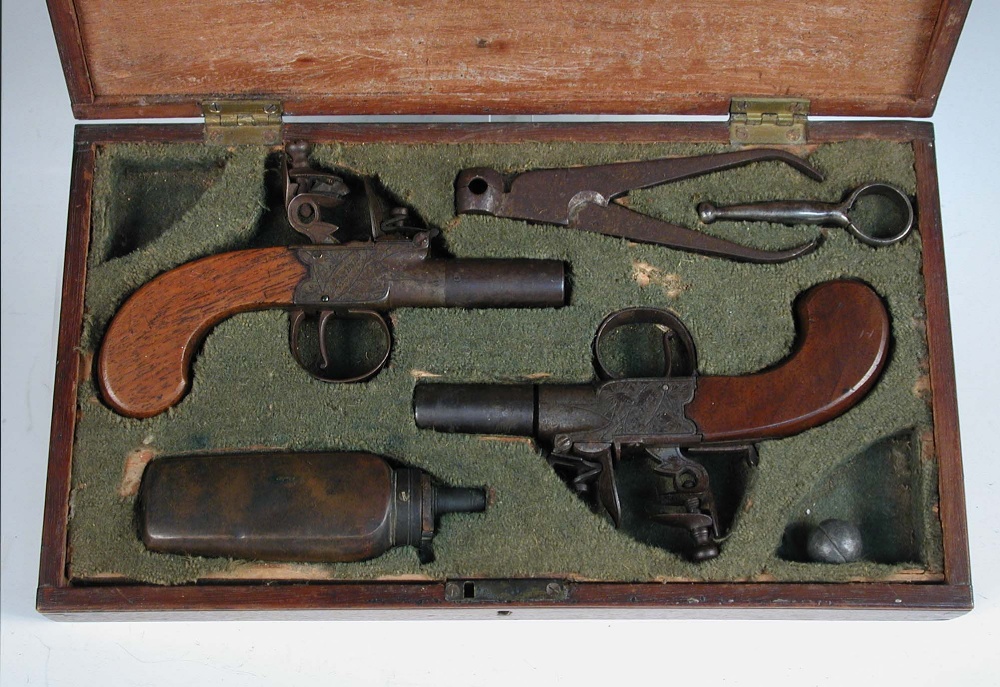 A pair of early 19th century flintlock pocket pistols, signed Frost, Peterboro, each with turn off