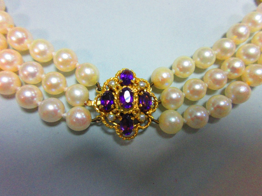 A three row pearl necklace with gold, amethyst and seed pearl clasp, the uniform 7.5-8mm cultured - Image 2 of 6