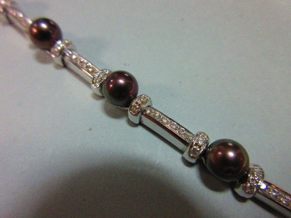 A black pearl and diamond bracelet and earring suite set in 18ct white gold, the bracelet designed - Image 5 of 5