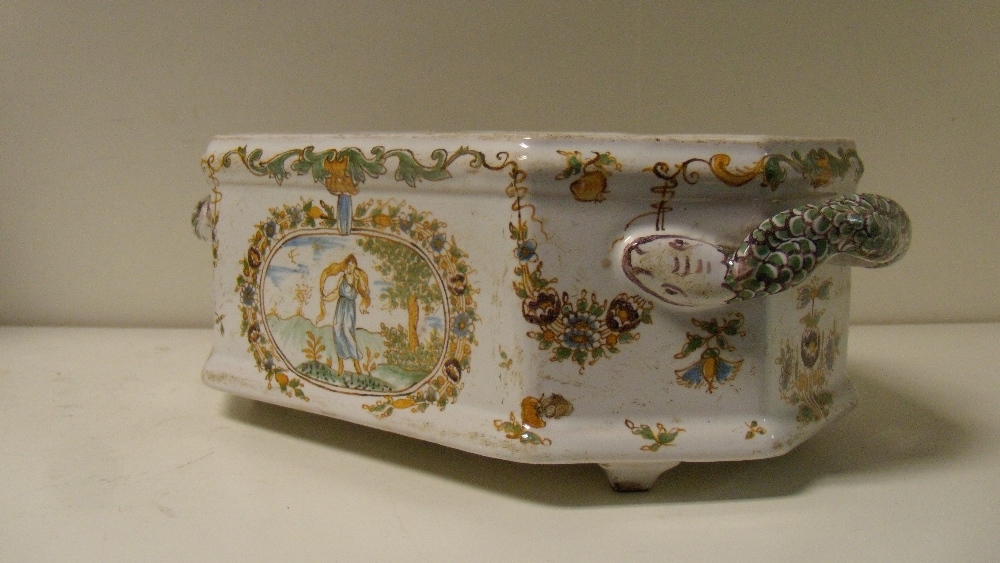 An 18th century French polychrome faience planter, probably Moustiers, the canted rectangular