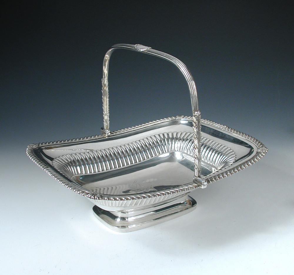 A Regency silver cake basket, by Paul Storr, London 1816, of rectangular shape, the body part fluted
