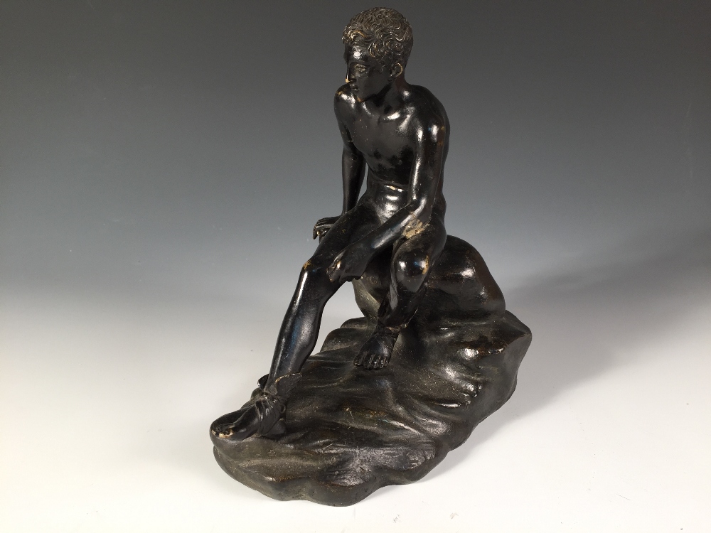 A 19th century bronze model of Mercury seated, modelled sitting upon a rock 22 x 20cm (9 x 8in)