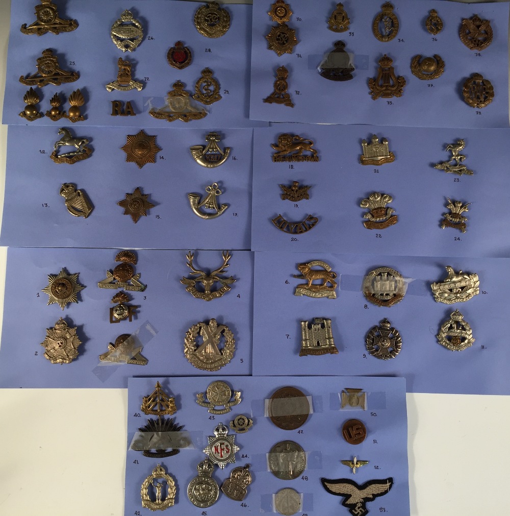 A collection of approximately fifty catalogued military badges, mostly British regiments, all