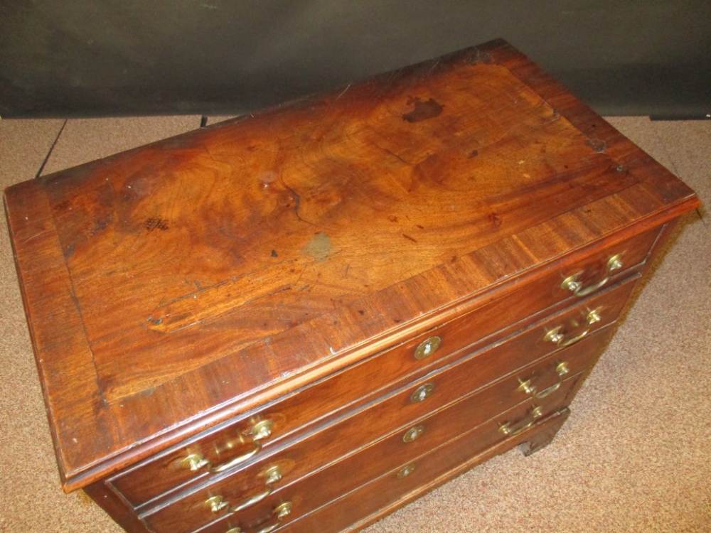 A George III mahogany chest of drawers, four long drawers, crossbanded top and sides, brass swan - Image 3 of 4