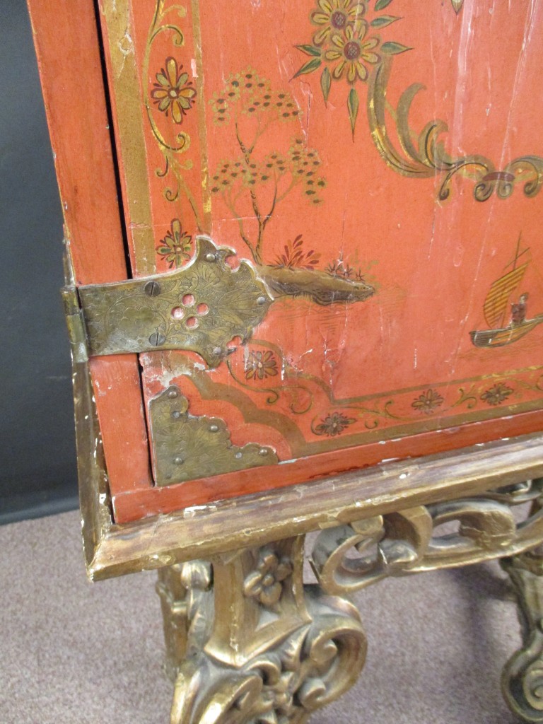 An 18th century Chinese red lacquer cabinet on a giltwood stand, decorated with a traditional - Image 5 of 9