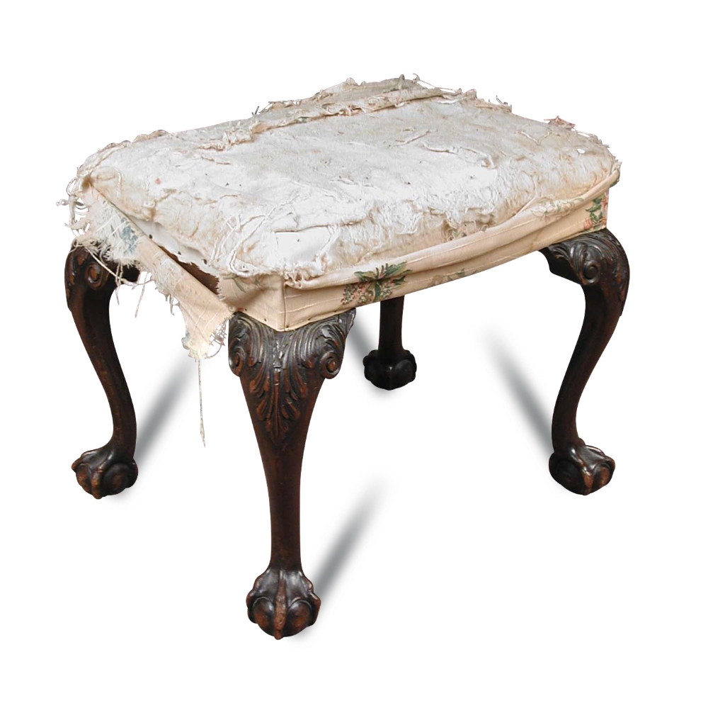 A George II style mahogany stool, overstuffed seat, on leaf carved cabriole legs, ball and claw feet