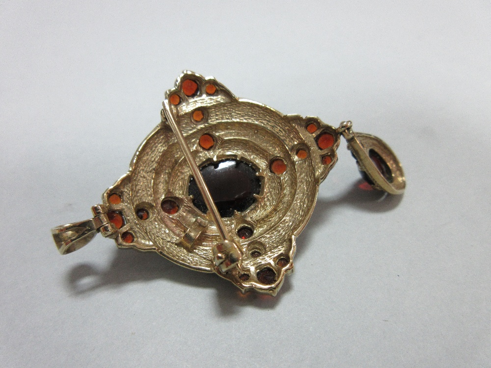 A gold and garnet Holbeinesque pendant / brooch, of oval tiered form, set to the cardinal points - Image 3 of 6