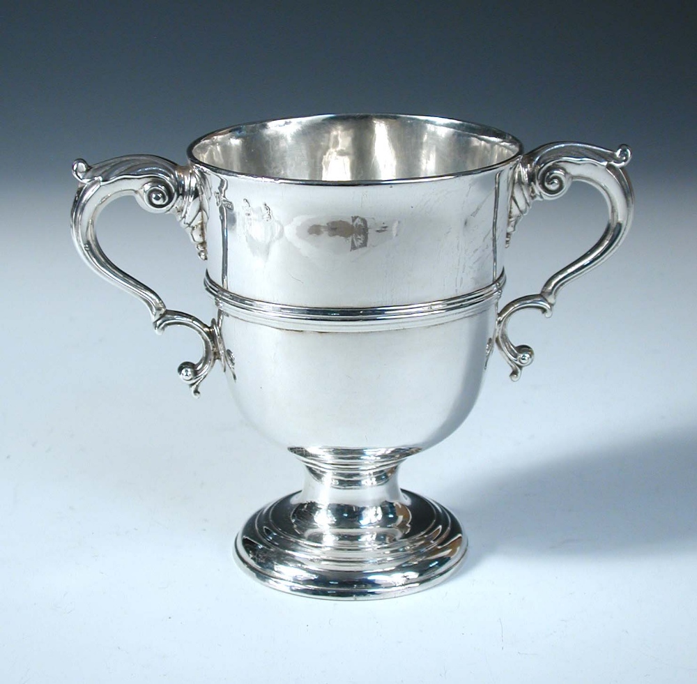 A George III Irish silver two handled cup, by Matthew West, Dublin 1771, of inverted bell shape