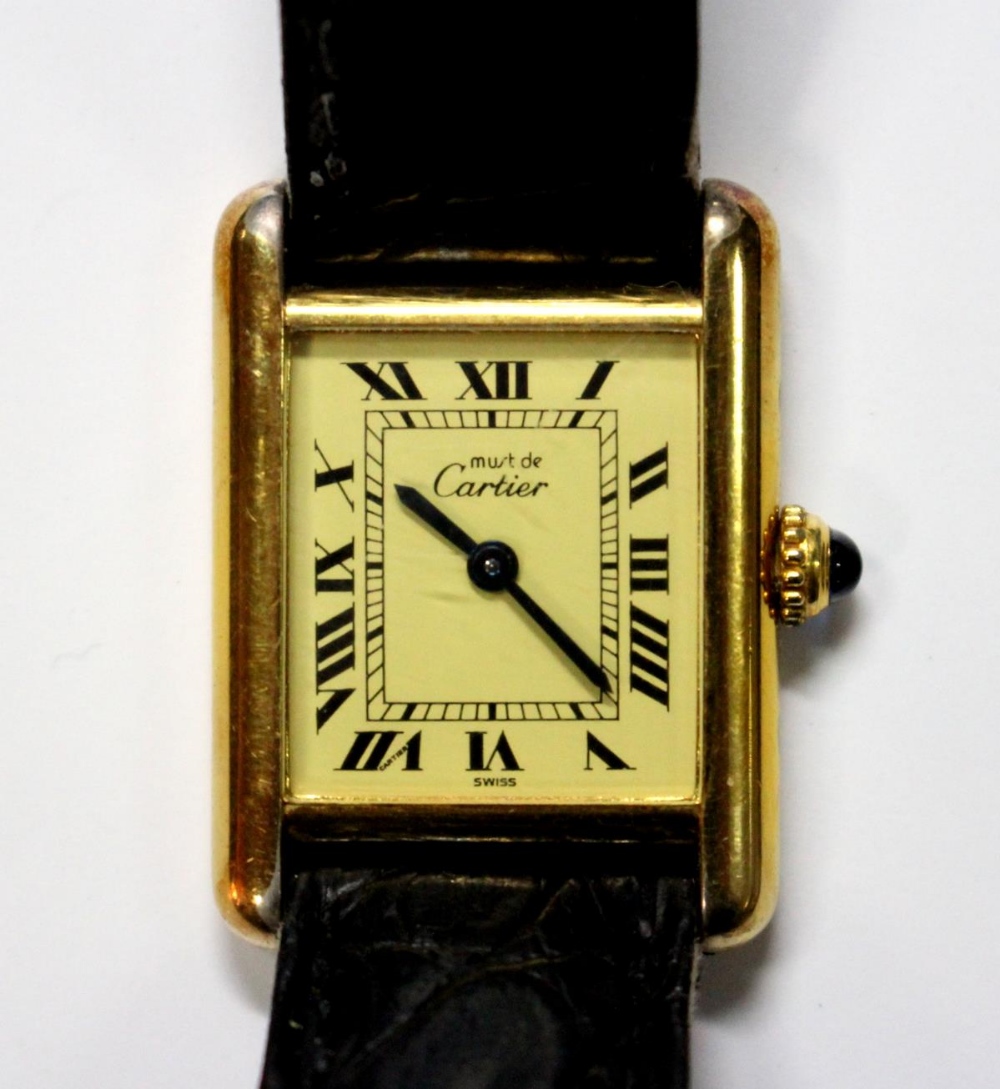 By Cartier - a lady's silver gilt 'Must de Cartier' quartz 'Tank' wristwatch, the rectangular