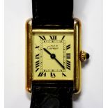 By Cartier - a lady's silver gilt 'Must de Cartier' quartz 'Tank' wristwatch, the rectangular