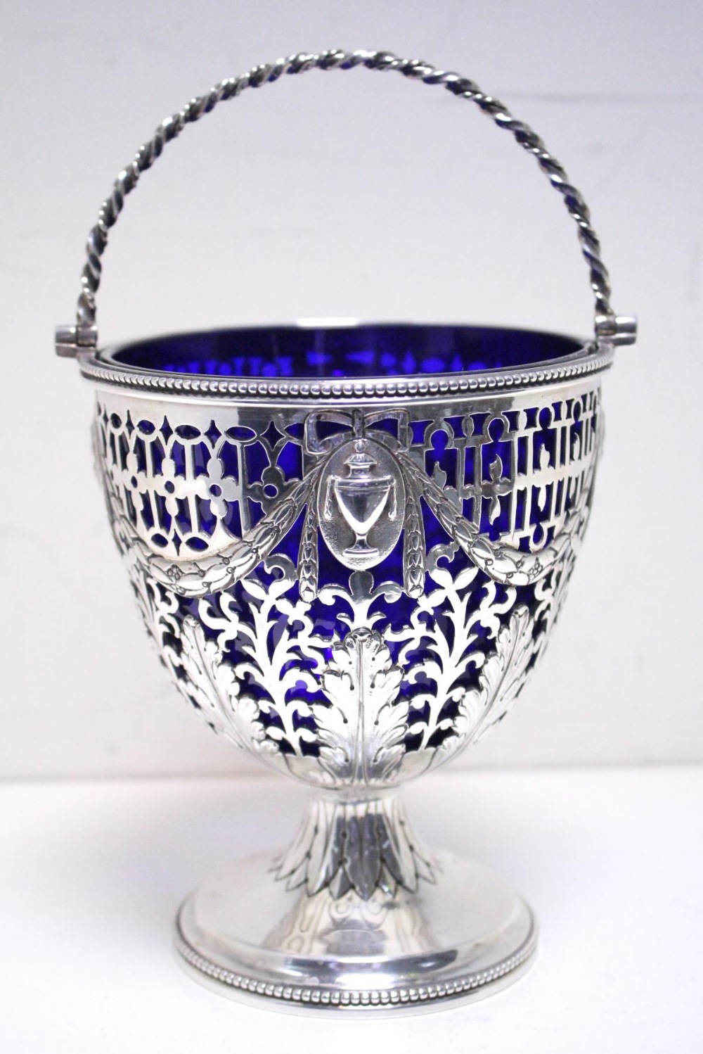 A George III silver sugar basket, by John Edwards III, London 1804, of vase shape the body festooned - Image 2 of 5